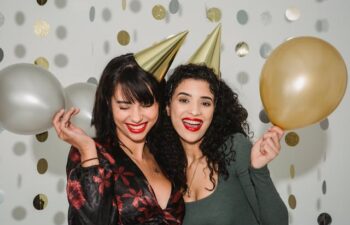 two women smiling during a party